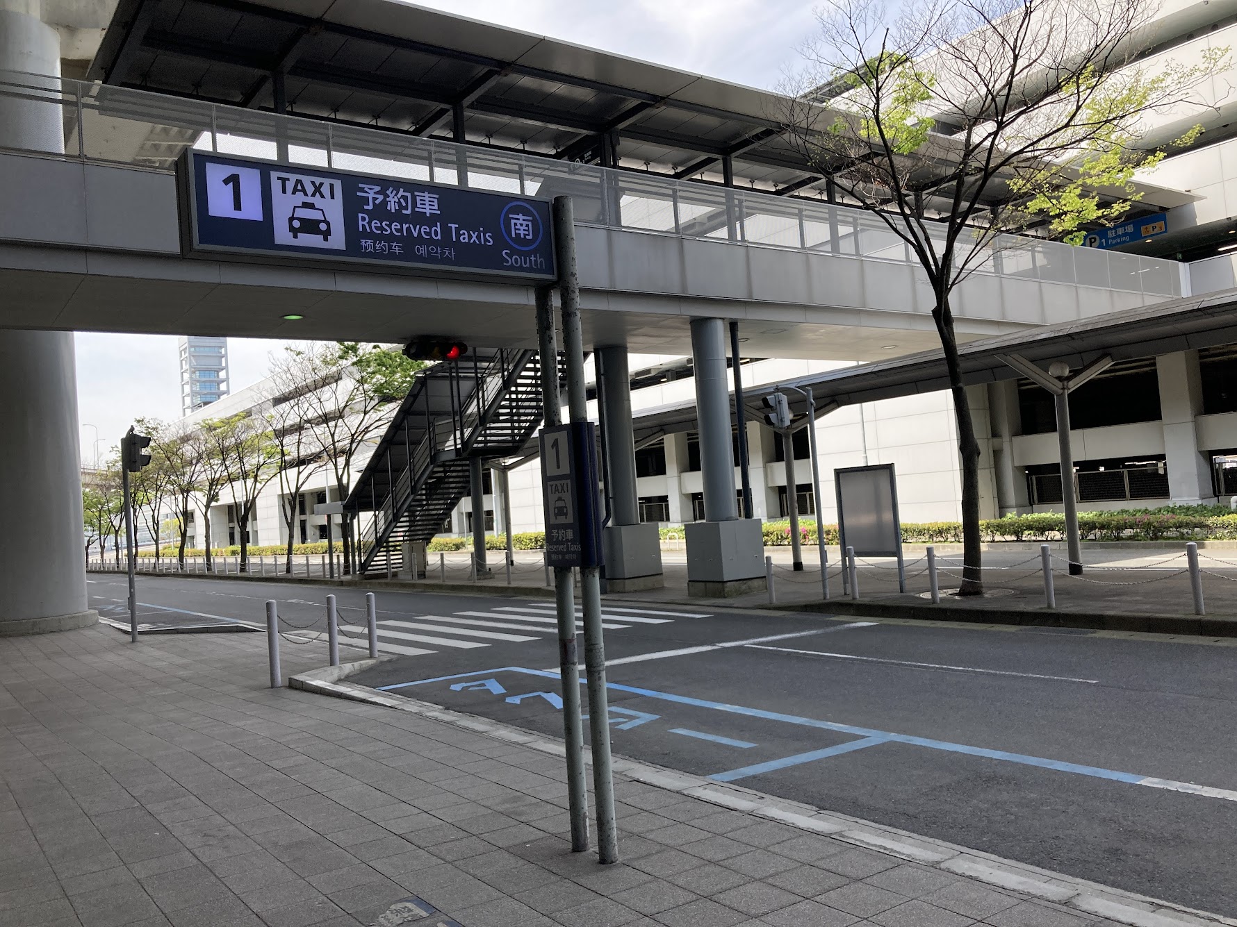 ![Taxi stand for reserved taxi at Kansai airport]