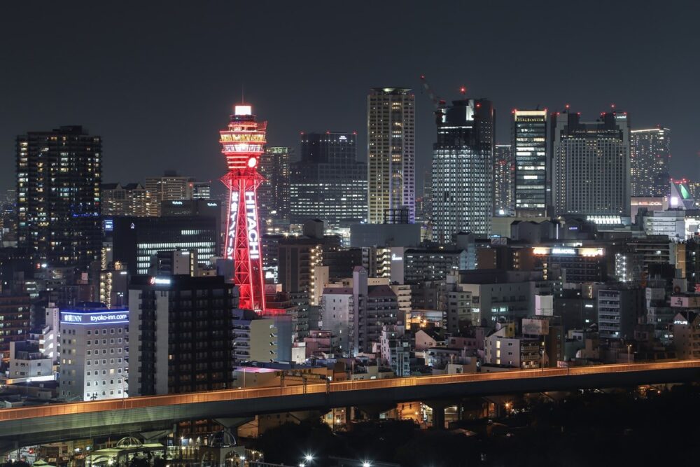 Illuminated Tsutenkaku Tower at night in Osaka